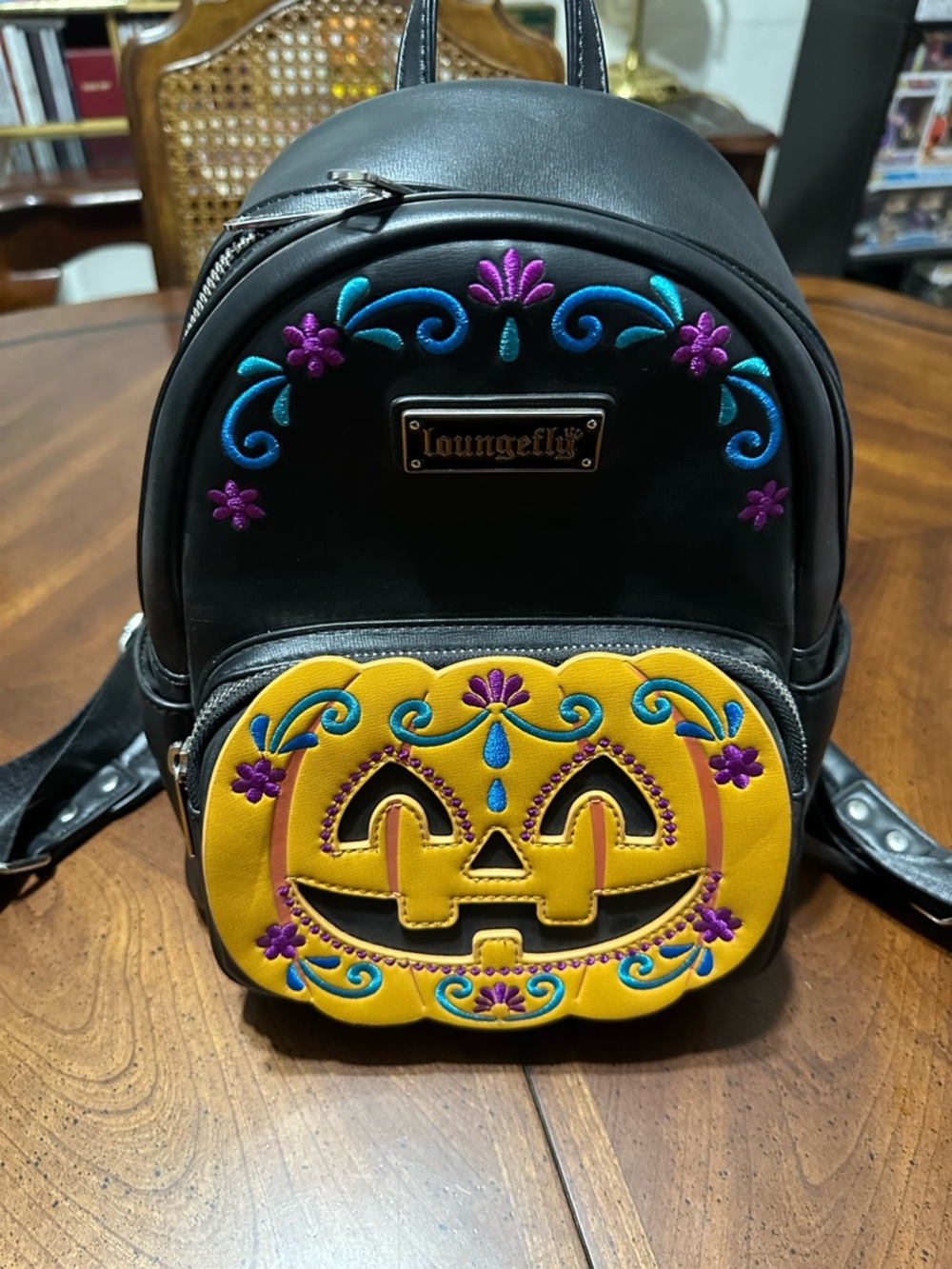 Loungefly Black Mini Backpack with Orange Jack-O'-Lantern Pocket